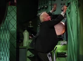 Clip of quote: Pay no attention to the woman behind the curtain!